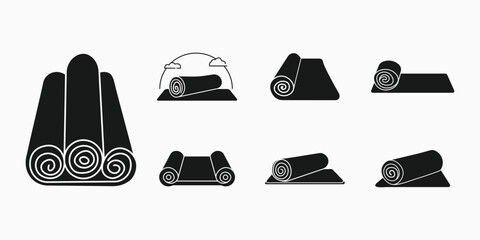 Collection of rolled and unrolled yoga mats for fitness and exercise