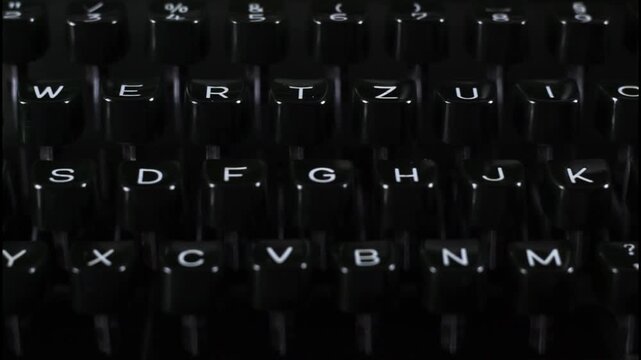 vintage type writer machine - dark keys - tracking horizontally - illustrates gothic ideas, dark novella writing or similar