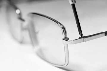 Repair and production of glasses, tools and lenses.