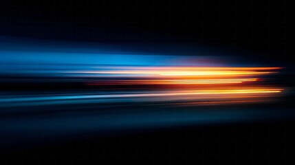 Streaks of bright orange and deep blue light blur across a dark background in a long exposure effect