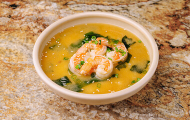 Savory shrimp soup with seaweed and green onions served in a bowl