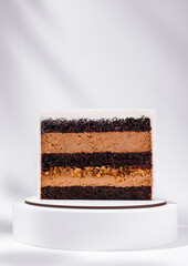 Delicious layered chocolate cake on a white display stand