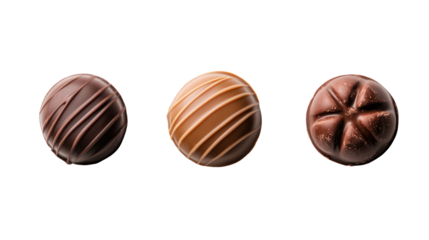 Three oval chocolate candies with decorative patterns isolated on transparent background