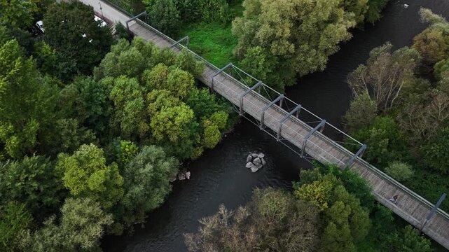 Aerial View of Wooden Bridge Over Autumn River