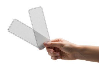 Hand holding two blank tags, showcasing a simple and clean presentation