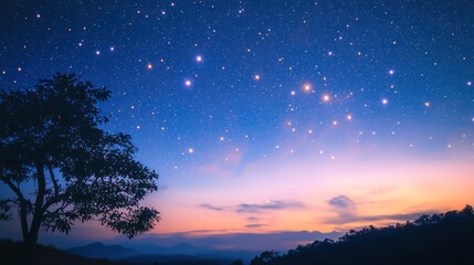 Naklejka premium A starry night sky with a silhouette of a tree and mountains in the foreground, and a colorful sunset in the background.