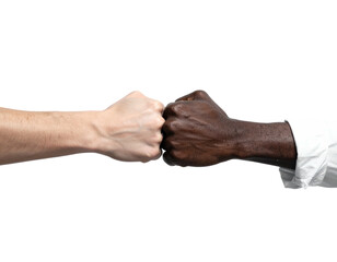 A close-up shot of two fists bumping together, representing diversity and unity