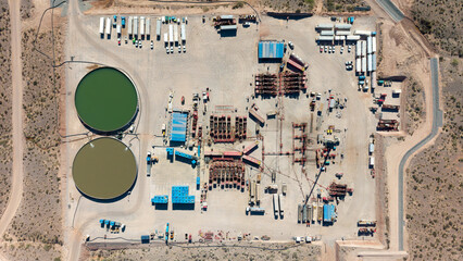Aerial view of unconventional oil and gas extraction (shale oil) in Añelo, Neuquén. Fracking equipment. Overhead view