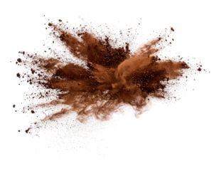 A cloud of brown powder explodes outwards against a solid black background