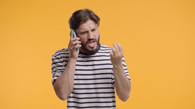 Angry Bearded Man Quarreling, Screaming Talking On Mobile Phone. Guy In Stress