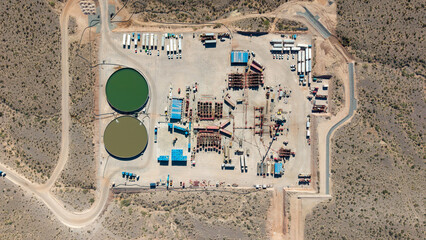 Aerial view of unconventional oil and gas extraction (shale oil) in Añelo, Neuquén. Fracking equipment. Overhead view