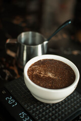 coffee cupping in a bowl and a few spoons