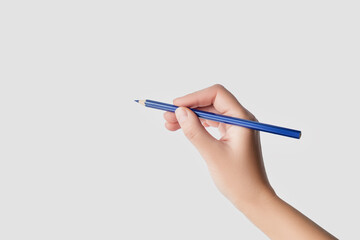 Hand Holding a Blue Pencil Ready to Write or Draw