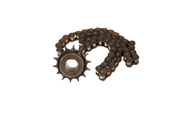 An old motorcycle sprocket and chain, thickly coated in black oil and grease, on a white background. Perfect for motorcycle repair and maintenance topics.