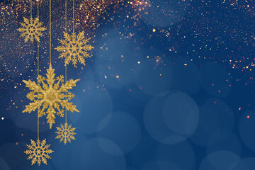 Christmas blue background of golden snowflakes on a string. Holiday card for New Year and Christmas with space for greetings, labels and your design.