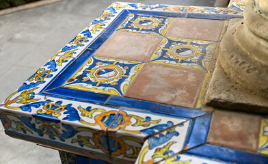 Close-up of colourful ceramic tiles with floral motifs in Sevilla