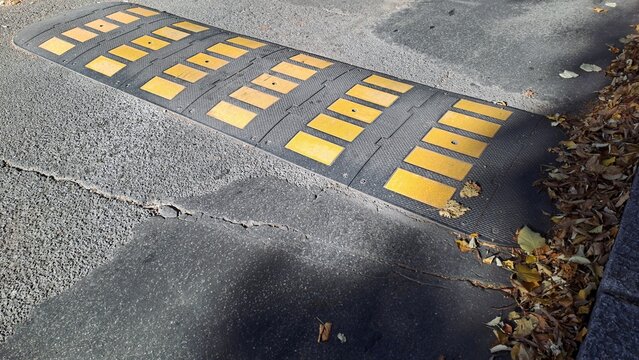 Rubber road hump and slow road bump, low angle view.