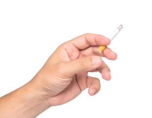 A hand holding a lit cigarette with a visible filter tip and ash, against a simple light gray background.