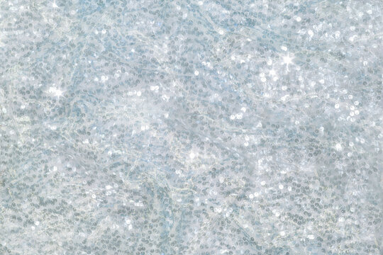 The background of the fabric is decorated with a scattering of silver sequins creating an abstract shimmer.