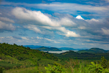 The landscape features vast green hills stretching into the distance can see the islands in the sea. Ranong, Thailand.