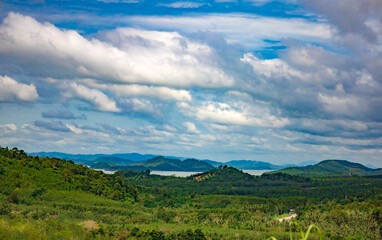 The landscape features vast green hills stretching into the distance can see the islands in the sea. Ranong, Thailand.