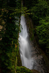 Obraz premium A gorgeous waterfall captured in long exposure, Punjaban Waterfall, national park, Ranong, Thailand.