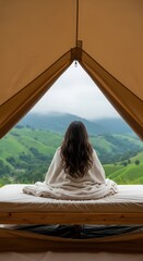 Person Resting in a Tent with a View of Rolling Hills. Serene Camping Scene with a Landscape Vista. Symmetrical Composition of a Tent Interior and Nature.