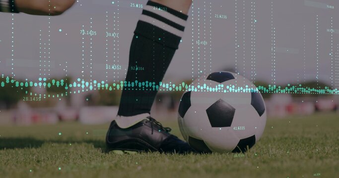 Showing player's legs wearing socks and cleats beside soccer ball on grass pitch, with data overlay