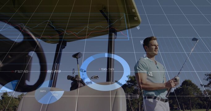 Gripping golf club, viewing line graphs, pie charts beside golf cart bag on fairway, copy space