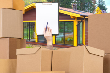 Relocation process with clipboard and checklist among cardboard boxes, home moving coordination and goods inventory management outdoors.