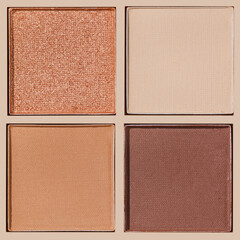 Closeup view Neutral Eyeshadow Palette with Matte and Shimmer, beige brown with golden shimmer shades. Top view of eyeshadow refills, Swatches powder eyeshadow or highlighter, cosmetic beauty, makeup