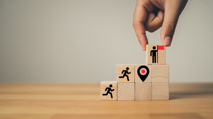 Minimalist business success concept showing teamwork, goal achievement, and leadership represented by wooden blocks and symbolic icons.