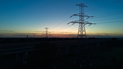 High voltage power lines at sunset