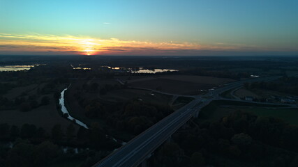Aerial sunset view over highway and vistula river landscape