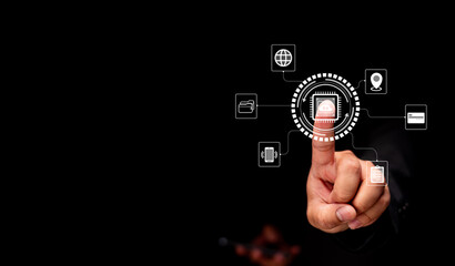 A hand interacting with digital icons, symbolizing technology and connectivity in a dark environment.