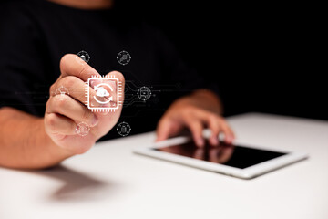 A hand interacts with a digital interface, showcasing technology and connectivity, with a tablet visible on the table.