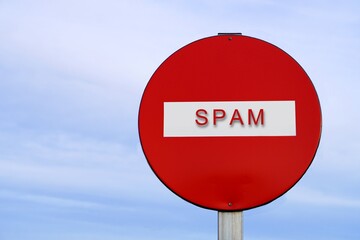 No spam. Word written on a red sign prohibiting passage.