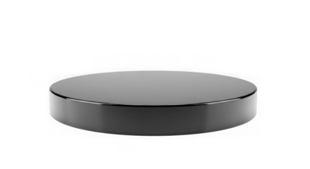 A single black hockey puck isolated on a black background