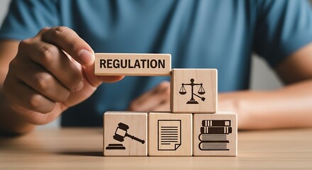 Hand stacking wooden blocks with regulation and law icons legal compliance