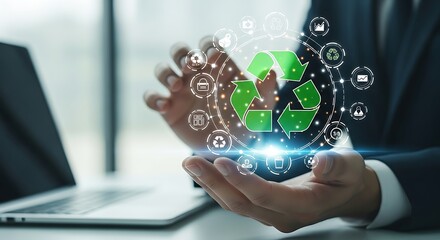 Businessman holding recycling symbol and eco-friendly icons in digital network environment