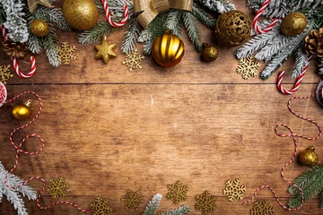 Fototapete Rund Musik Christmas and New Year background with a festive scene with gold and red Christmas ornaments and fir tree branches on a wooden background, symbolizing holiday spirit and elegance.  © petrrgoskov