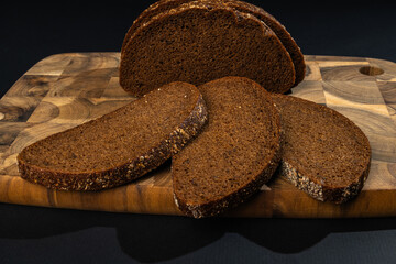 Slices of rye bread isolated on black background