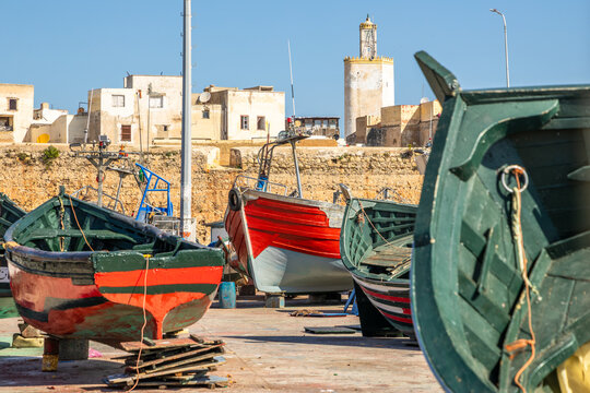 Old port with wooden boats and fortress walls, El Jadida, Morocco