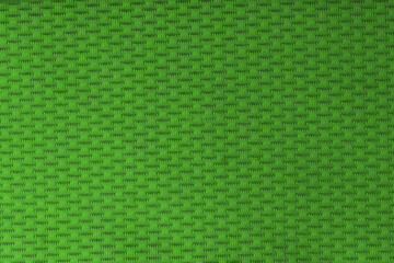 Vibrant green textured fabric background with a woven pattern