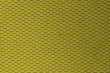 sports mesh fabric Close up of a textured yellow green with a repeating pattern