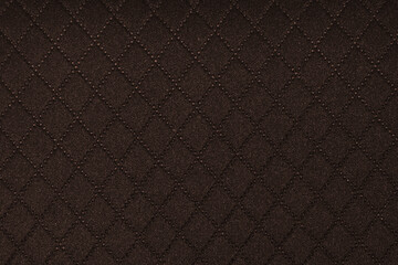 Close up texture of dark brown woven fabric with a subtle ribbed pattern