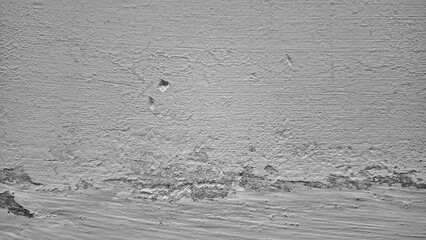 Cracked concrete wall background with peeling paint, damaged old surface and moisture stains...