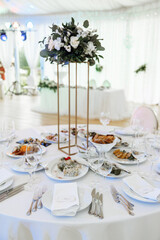 Detailed close-up of a wedding place setting featuring a small name card 