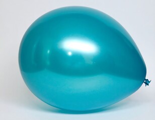 Vibrant Teal Balloon Floating in a Softly Lit Studio Setting.