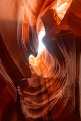 Waves of sandstone illuminated by sunlight in Upper Antelope Canyon, Arizona
